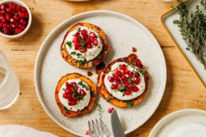 Sweet potato slices with fresh goat cheese and pomegranate