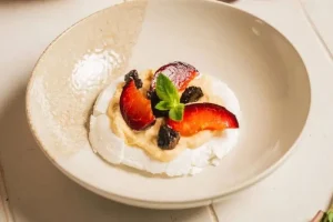Pavlova with plums and Agen prunes