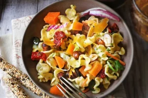 Pasta salad with Mimolette and hazelnuts